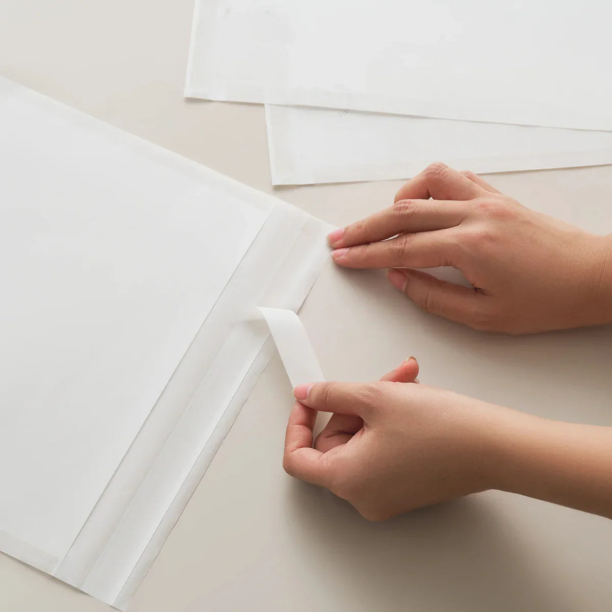 Eco-friendly glassine bag with self-adhesive strip for convenience