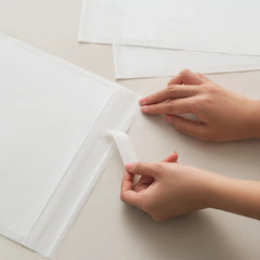 Eco-friendly glassine bag with self-adhesive strip for convenience